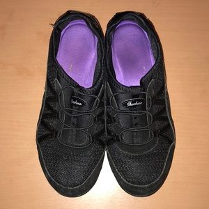 Black Skechers slip on sneakers